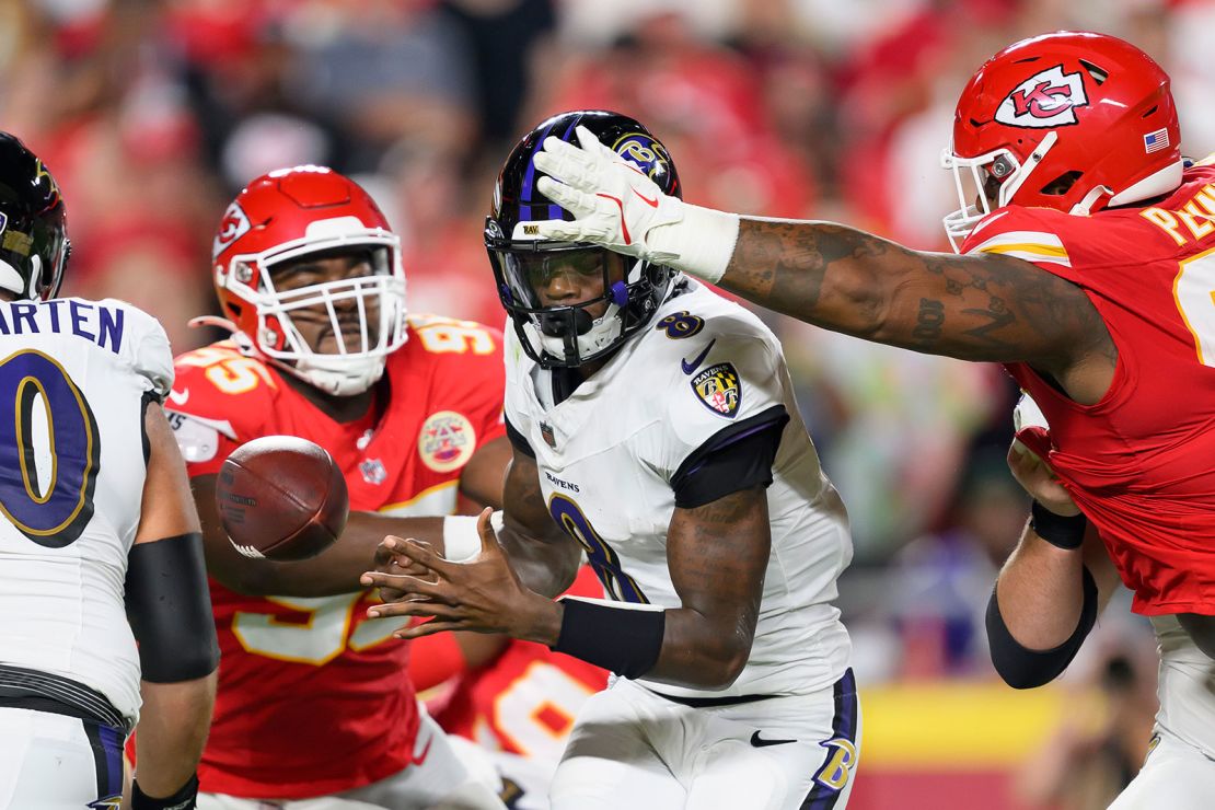 Chiefs defensive tackle Chris Jones knocks the ball out of the hands of Jackson (8).