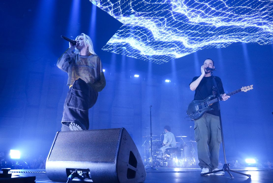 Emily Armstrong, from left, Colin Brittain, and Mike Shinoda of Linkin Park performing on Thursday.