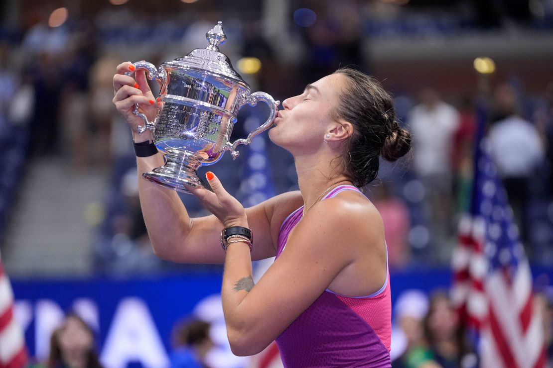 Aryna Sabalenka kisses the trophy after winning the US Open for the first time.