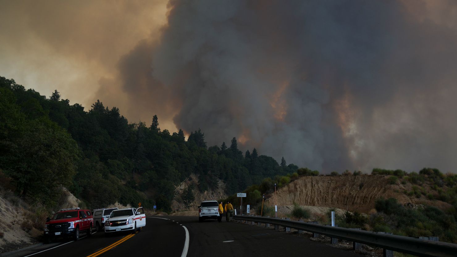 Fire crews monitor the Line Fire on Saturday near Running Springs, California.