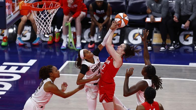 INDIANAPOLIS, IN - SEPTEMBER 08: Indiana Fever guard Caitlin Clark (22) goes up strong with her shot while being defended by Atlanta Dream guard Jordin Canada (3) in the third quarter of play during a WNBA game between the Atlanta Dream and the Indiana Fever on September 08, 2024 at Gainbridge Fieldhouse in Indianapolis, IN. (Photo by Jeffrey Brown/Icon Sportswire) (Icon Sportswire via AP Images)