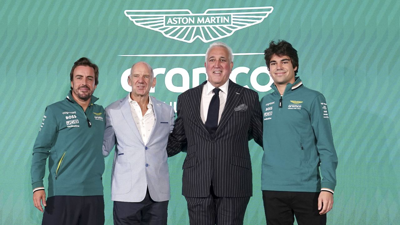 Aston Martin Aramco Formula One Team drivers, Fernando Alonso (left) and Lance Stroll (right) with Adrian Newey, newly appointed managing technical partner and Lawrence Stroll, Executive Chairman.