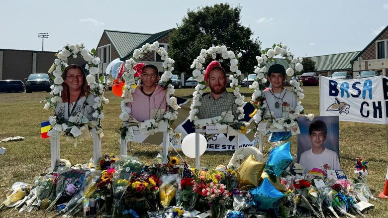 A poster with images of shooting victims from left, Cristina Irimie, Mason Schermerhorn, Richard Aspinwall and Christian Angulo is displayed at a memorial outside Apalachee High School in Winder, Georgia, on September 10, 2024.