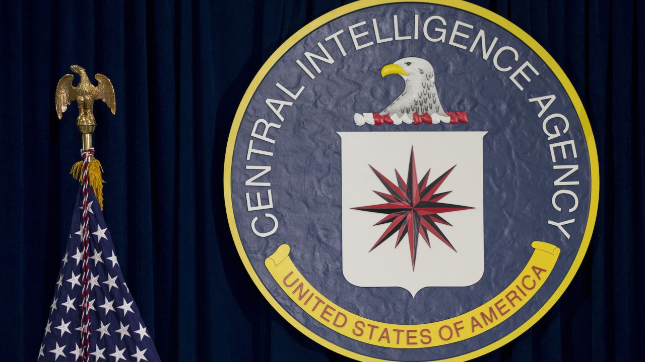 FILE - The seal of the Central Intelligence Agency stands next to a U.S. flag at CIA headquarters in Langley, Va. (AP Photo/Carolyn Kaster, File)