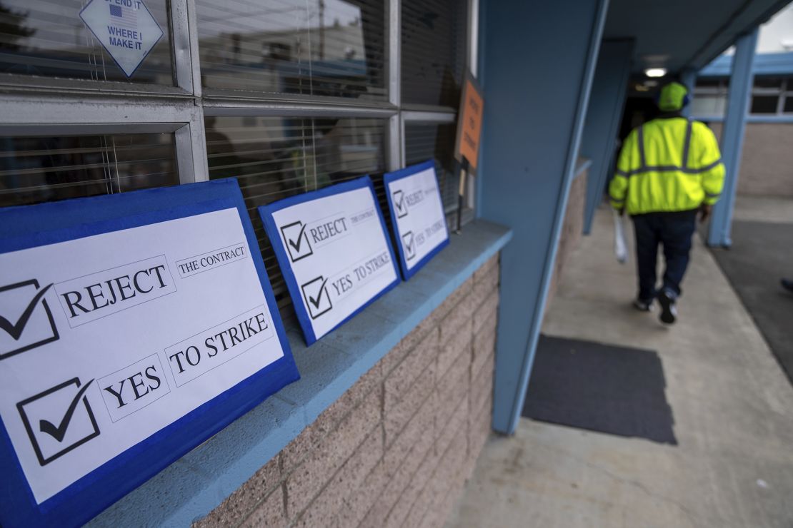 Signs encouraging International Aerospace Machinists union members to vote "no" on a contract offer with airplane maker Boeing are pictured at the union's hall on September 12, in Renton, Washington.