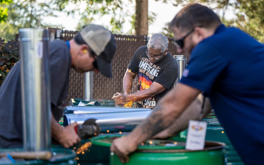 Clint Moore (center), a member of the International Aerospace Machinists, and other union members build fuel barrels in preparation for a strike if members reject a contract offer from aircraft manufacturer Boeing on September 12, 2024 in Seattle, Washington.