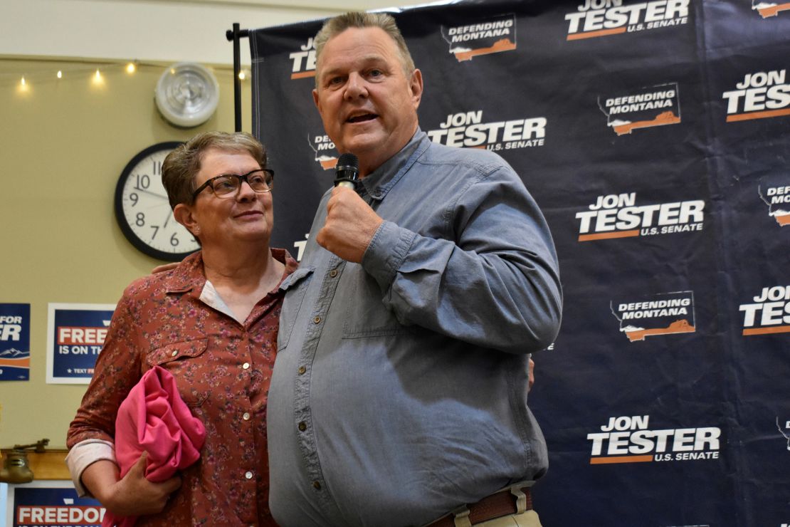 Montana State Sen. Jon Tester stands next to his wife Sharla at a campaign rally in Bozeman on September 5, 2024.