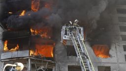 Firefighters tackle a blaze after a Russian aerial bomb struck a multi-story residential building in Kharkiv, Ukraine, Sunday Sept. 15, 2024.