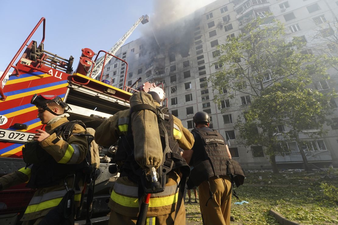 Firefighters work to extinguish a fire after a Russian airstrike hit a high-rise apartment building in Kharkiv, Ukraine, Sunday, September 15, 2024.