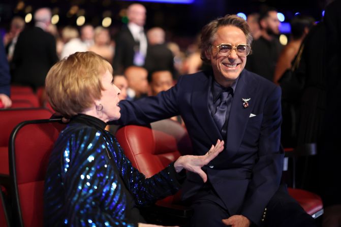 Carol Burnett and Robert Downey Jr. chat in the audience at the Peacock Theater.