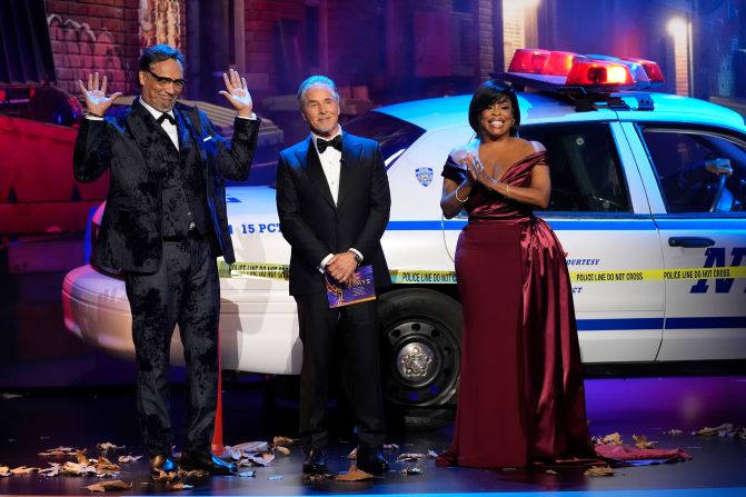 From left, Jimmy Smits, Don Johnson and Niecy Nash-Betts — who all played law enforcement officers on TV —  <a href="https://www.cnn.com/entertainment/live-news/emmy-awards-levy-09-15-24#h_10610707091b1a13ca928a9e4137e98b">present the Emmy</a> for outstanding lead actor in a limited series, anthology or TV movie.