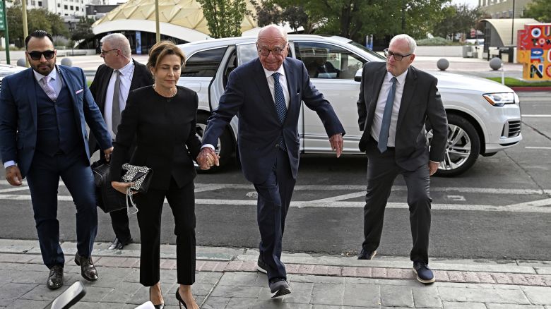 Rupert Murdoch, center, and his wife Elena Zhukova Murdoch arrive at the Second Judicial District Court in Reno, Nev., Monday Sept. 16, 2024.