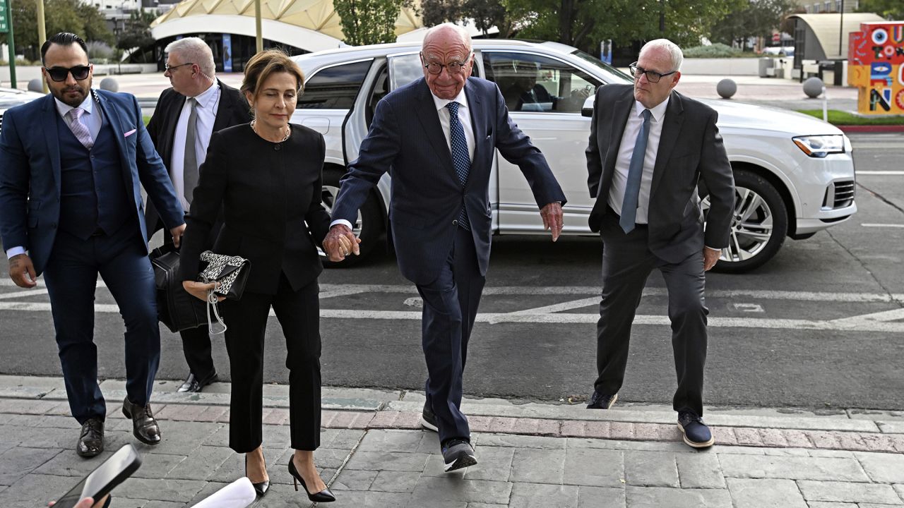 Rupert Murdoch, center, and his wife Elena Zhukova Murdoch arrive at the Second Judicial District Court in Reno, Nev., Monday Sept. 16, 2024.