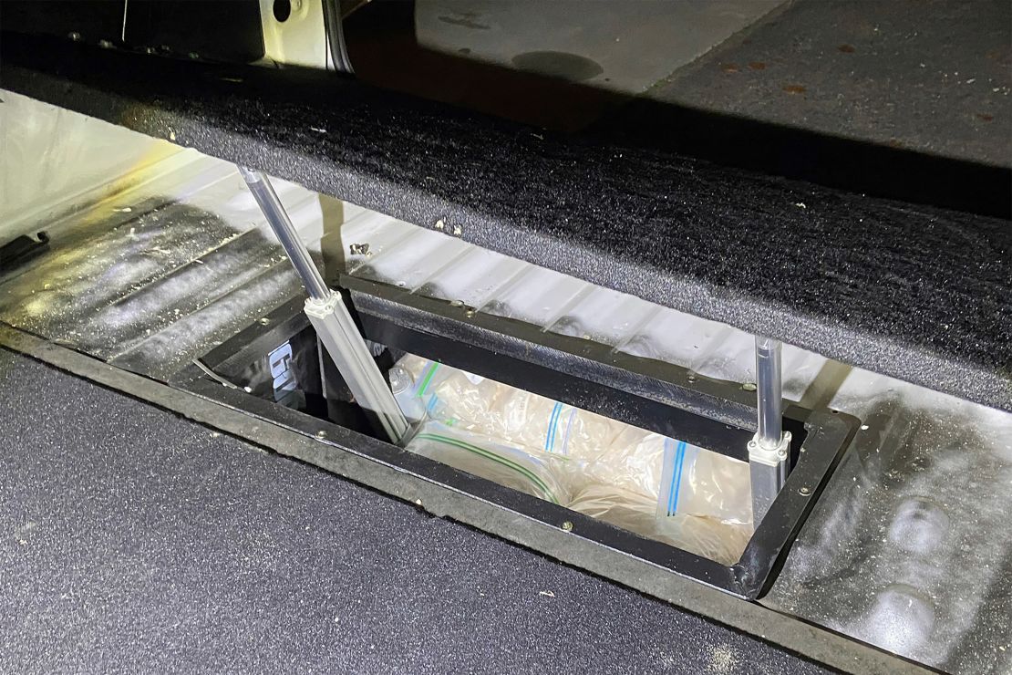 In an undated photo provided by the Australian Federal Police, illicit drugs are found in a concealed compartment in a vehicle.