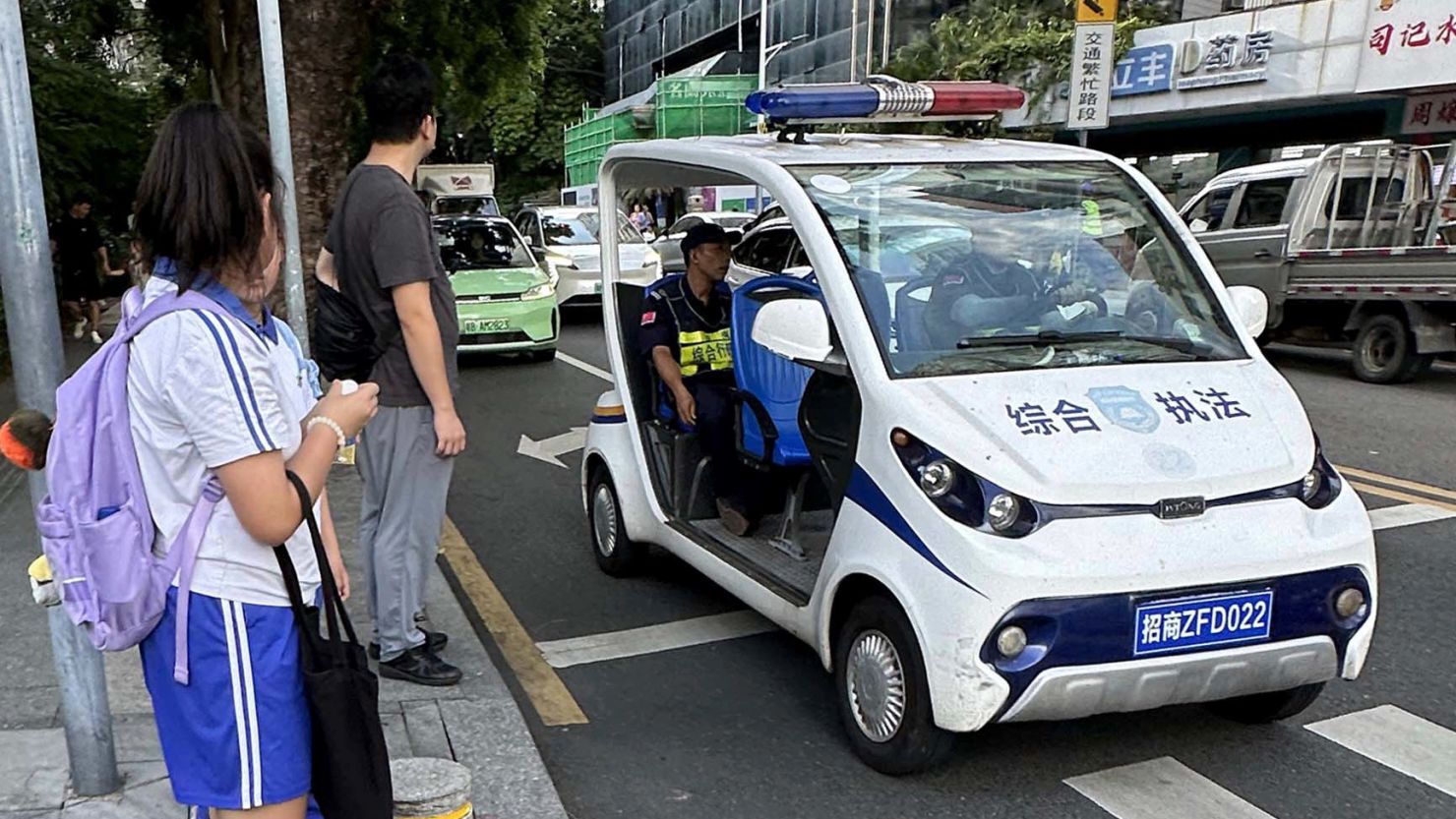 Security personnel stand guard near the site of a knife attack near a Japanese school in Shenzhen, China on September 18, 2024.