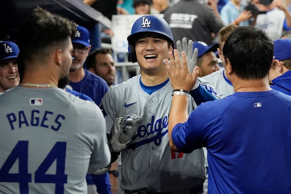 Los Angeles Dodgers' Shohei Ohtani (17) celebrates his 50th home run of the season during the seventh inning of a baseball game against the Miami Marlins, Thursday, Sept. 19, 2024, in Miami. (AP Photo/Marta Lavandier)