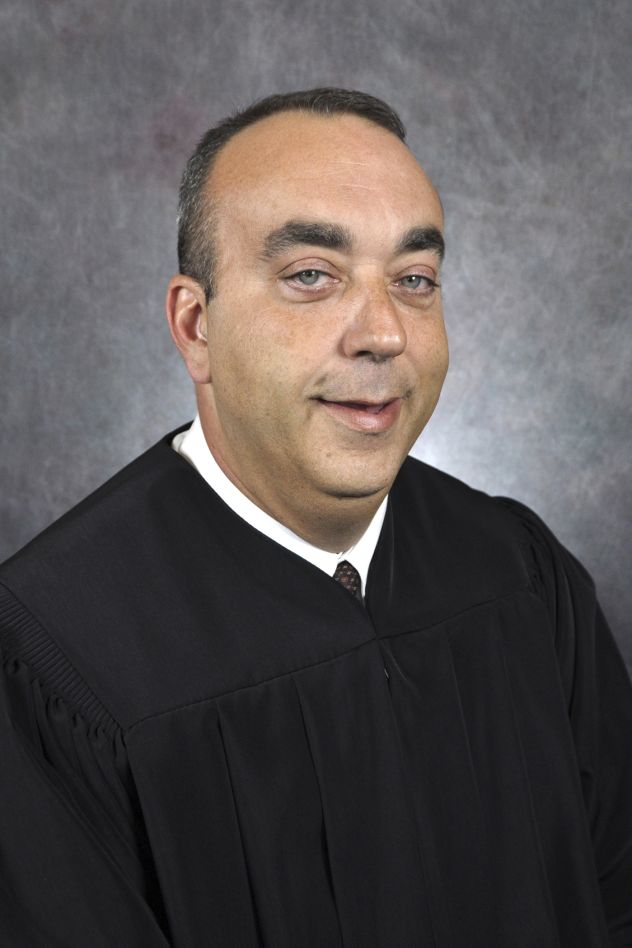 This undated photo provided by Kentucky Court of Justice shows slain District Judge Kevin Mullins.
