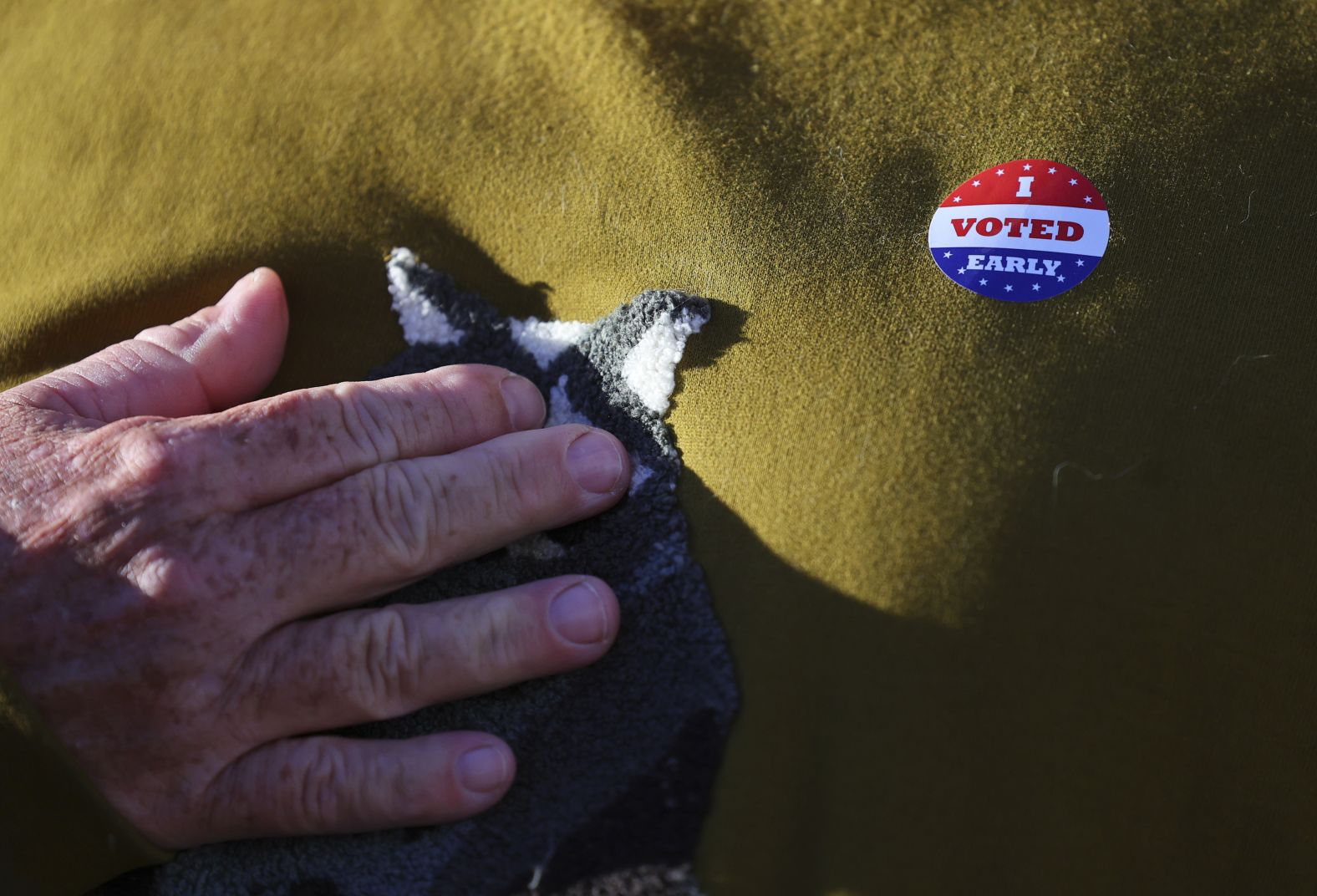 Voter Scott Graham wears an early voting sticker after casting his ballot in Minneapolis on September 20.