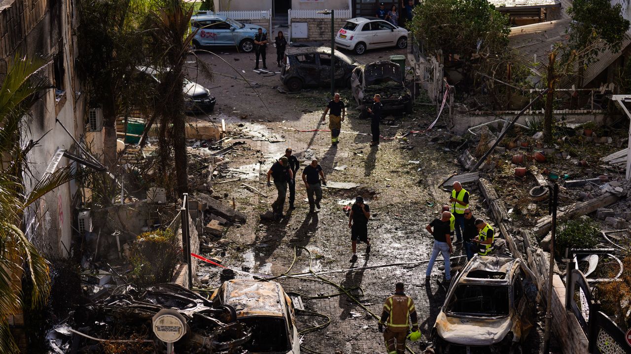 Israeli security forces inspect the site hit by a rocket fired from Lebanon, in Kiryat Bialik, northern Israel, on Sunday, September 22, 2024.