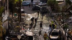 Israeli security forces examine the site hit by a rocket fired from Lebanon, in Kiryat Bialik, northern Israel, on Sunday, Sept. 22, 2024.