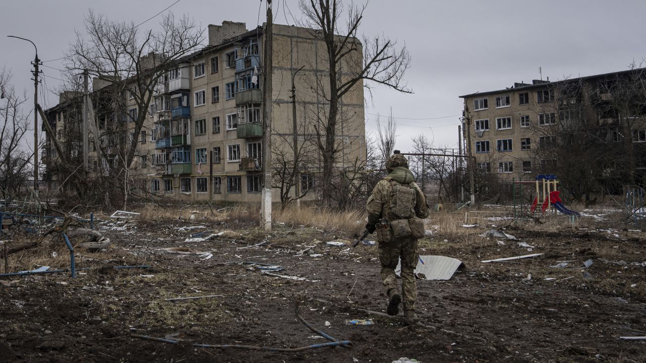 FILE - A Ukrainian marine serviceman runs to take a position through the residential blocks in the frontline city of Vuhledar, Ukraine, Feb. 25, 2023. (AP Photo/Evgeniy Maloletka, File)