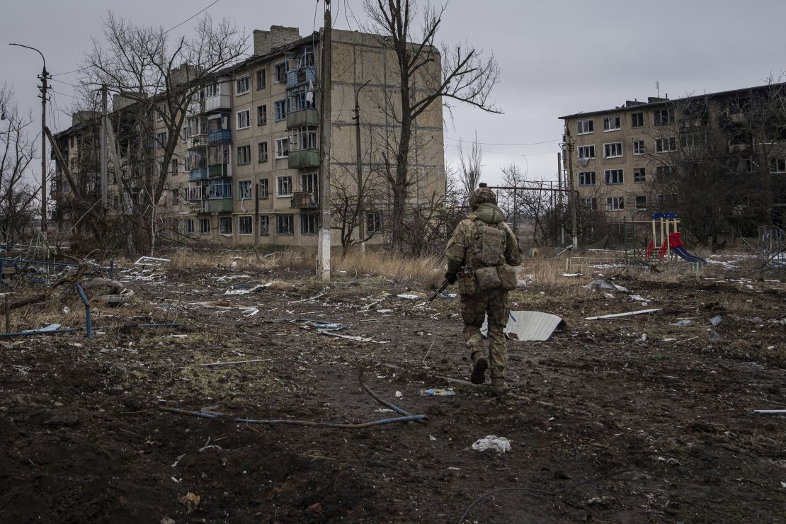 FILE - A Ukrainian marine serviceman runs to take a position through the residential blocks in the frontline city of Vuhledar, Ukraine, Feb. 25, 2023. (AP Photo/Evgeniy Maloletka, File)