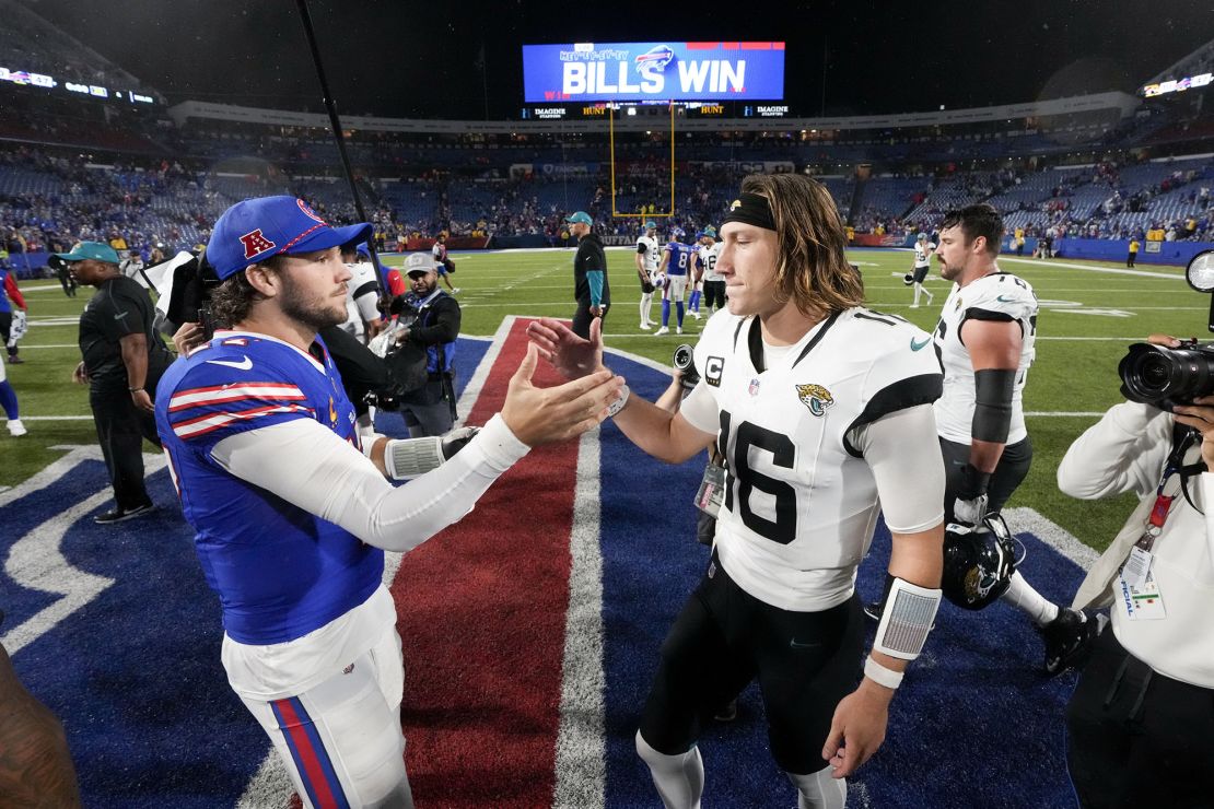 Bills quarterback Allen (left) shakes hands with Jaguars quarterback Lawrence (right) after Buffalo's win.