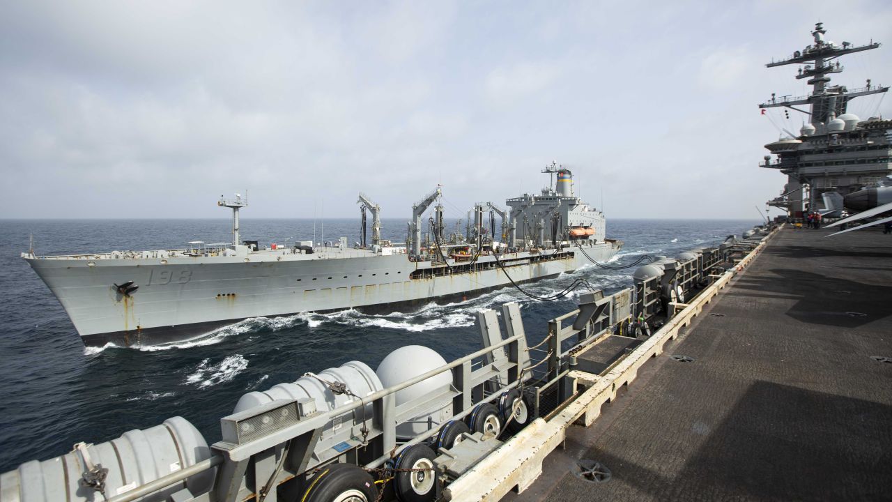 This handout photo from the U.S. Navy shows the Henry J. Kaiser-class fleet replenishment oiler USNS Big Horn sailing alongside the aircraft carrier USS Abraham Lincoln on Sept. 11, 2024, at an undisclosed location at sea in the Middle East. The Big Horn sustained damage in an incident which is under investigation, officials said Tuesday, Sept. 24, 2024. (U.S. Navy via AP)