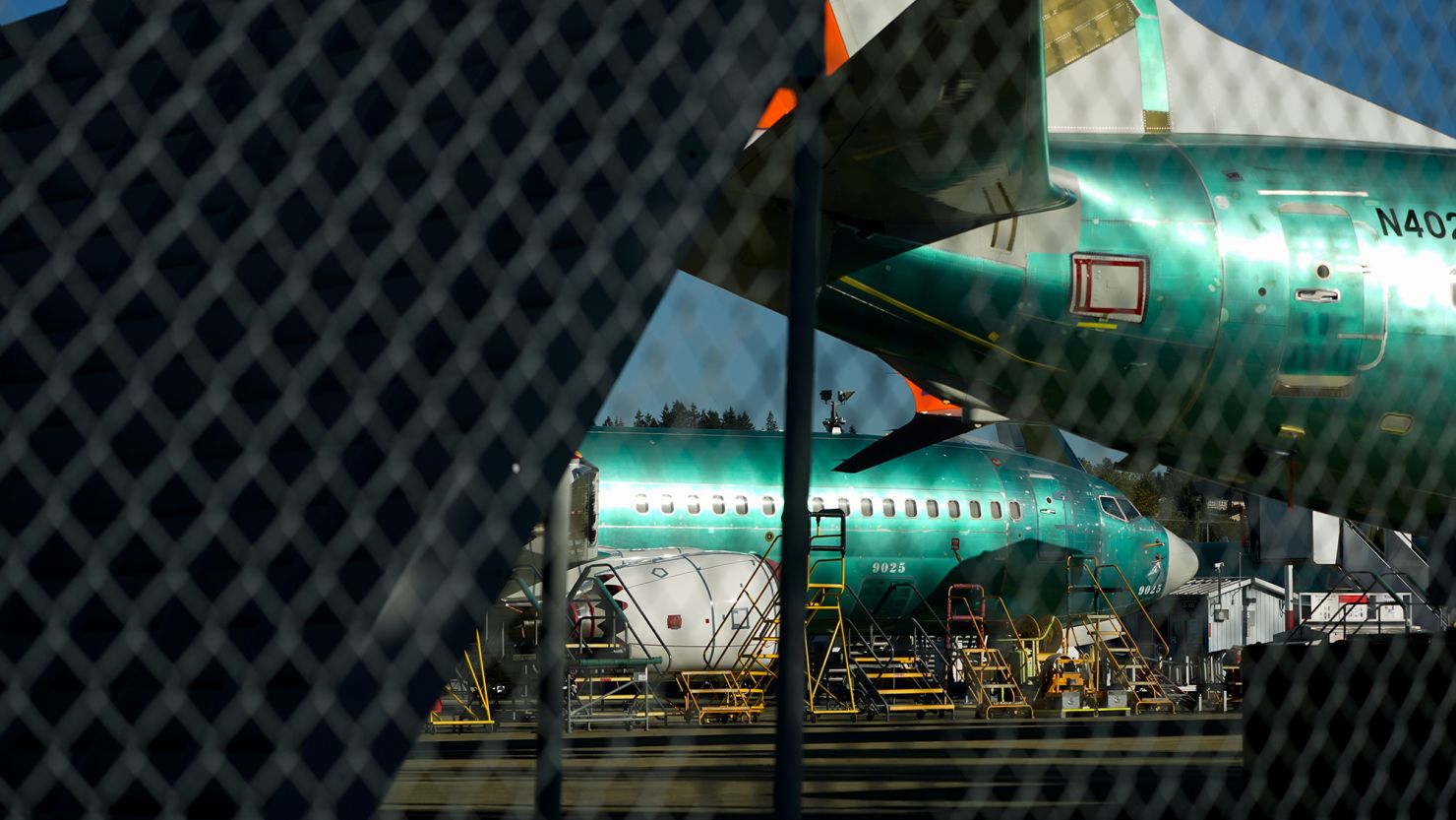 Boeing 737 Max aircrafts are seen behind fences, Tuesday, Sept. 24, 2024, at the company's facilities in Renton, Wash.