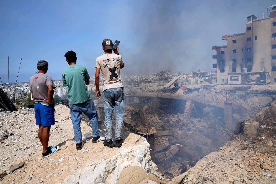 People survey the damage from an Israeli strike in Choueifat, south east of Beirut, Lebanon, on Saturday. Western leaders have warned of devastating consequences, as Israel intensifies attacks in the region.