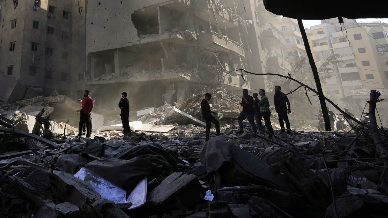 People check the site of the assassination of Hezbollah leader Hassan Nasrallah in Beirut's southern suburbs, on September 29.