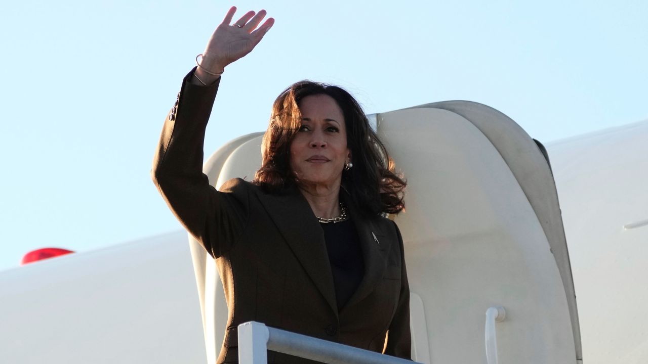 Vice President Kamala Harris waves while boarding Air Force Two in Los Angeles on Sunday.