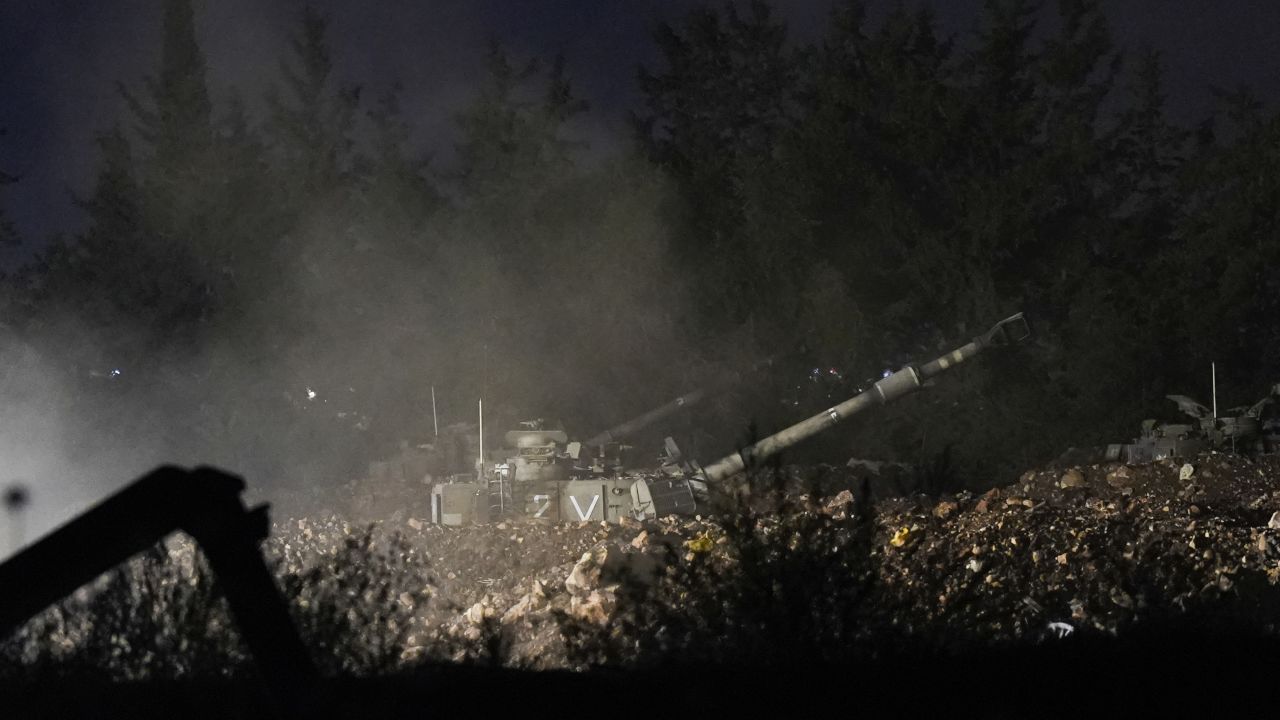 An Israeli mobile artillery unit fires a shell from northern Israel towards Lebanon, in a position near the Israel-Lebanon border, on Monday, September 30.