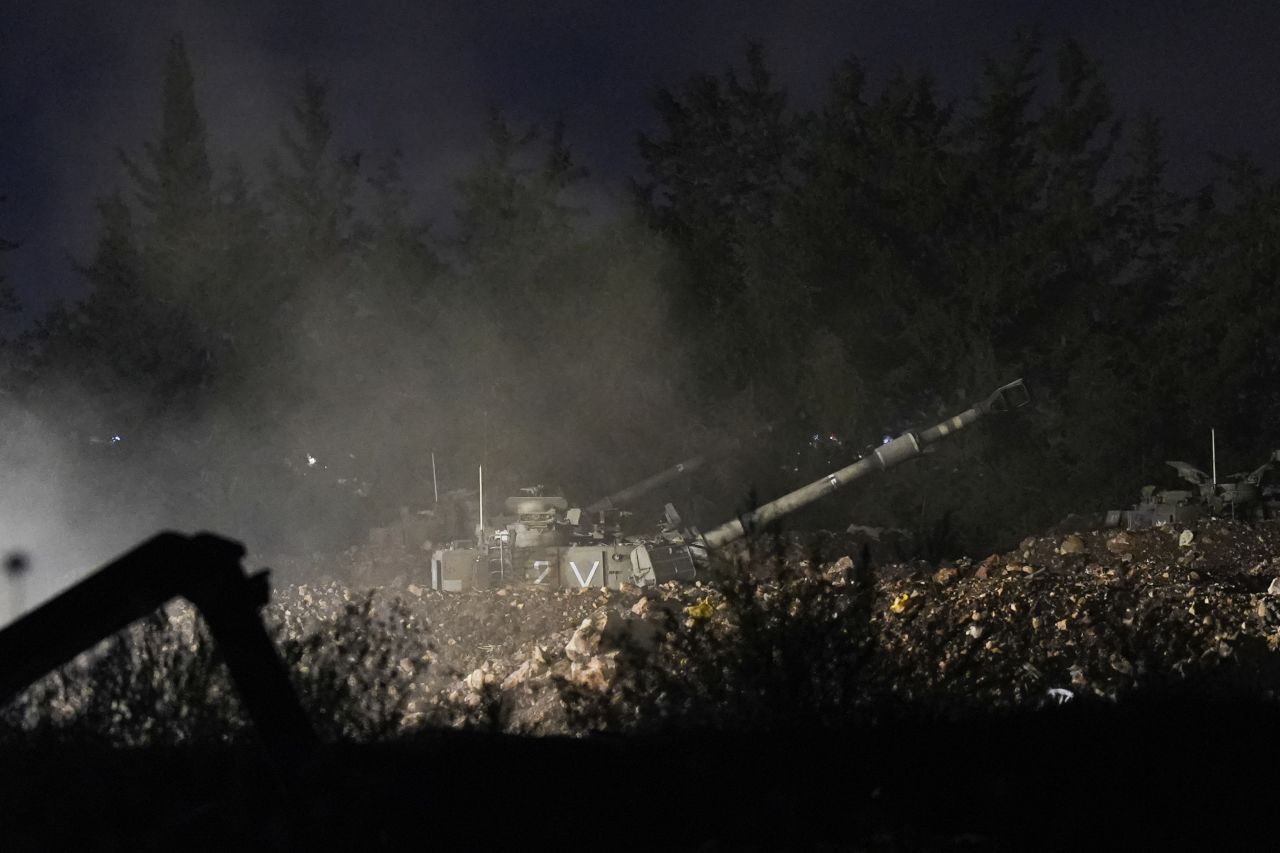 An Israeli mobile artillery unit fires a shell from northern Israel towards Lebanon, in a position near the Israel-Lebanon border, on Monday, September 30.