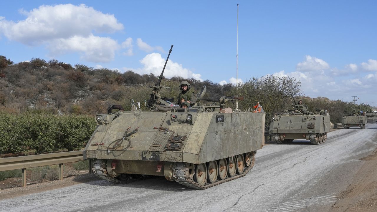 A convoy of Israeli army armoured personnel carriers moving on a road in northern Israel near the Israel-Lebanon border, on October 1.