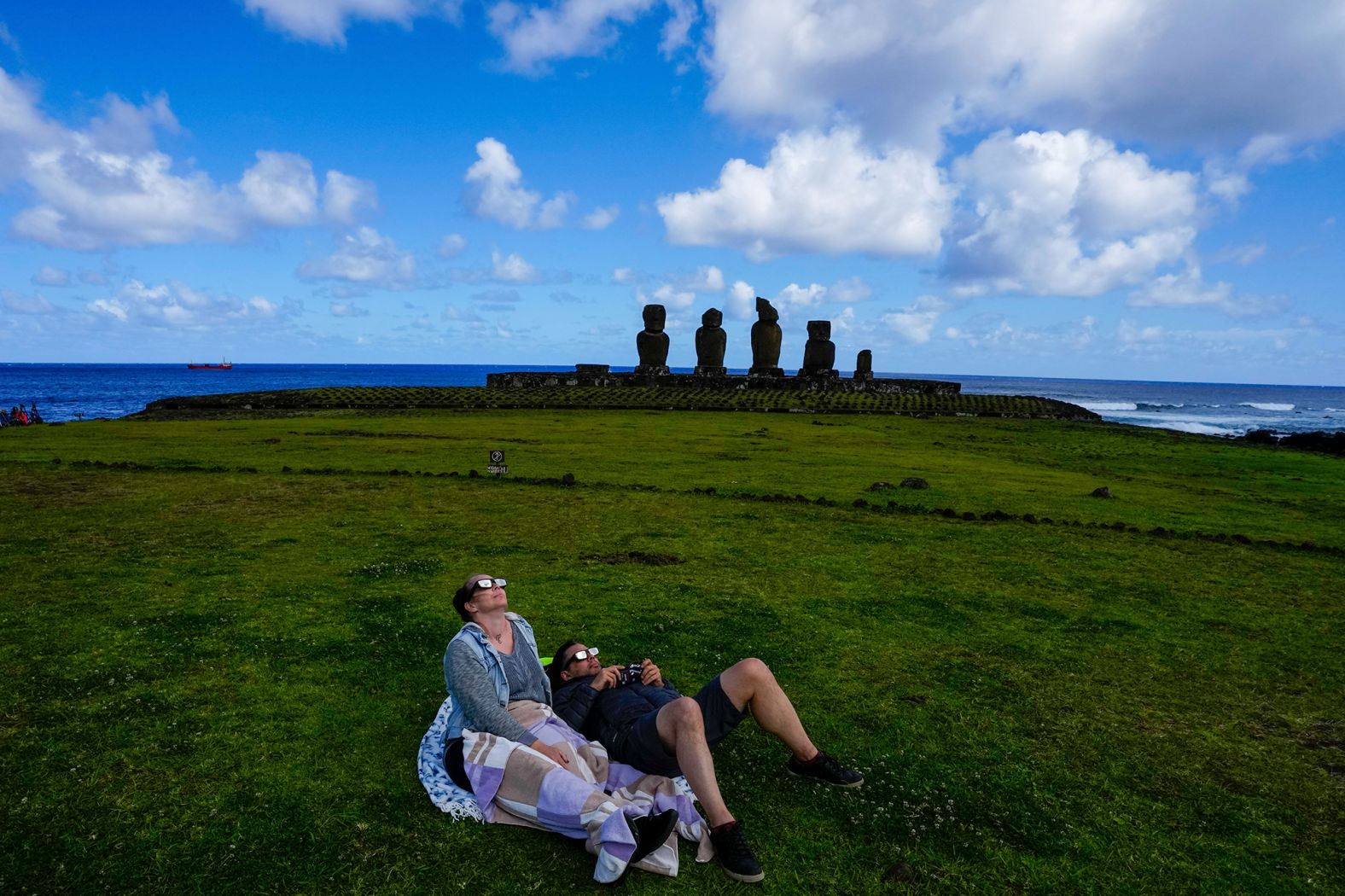 People watch the annular solar eclipse on Easter Island.