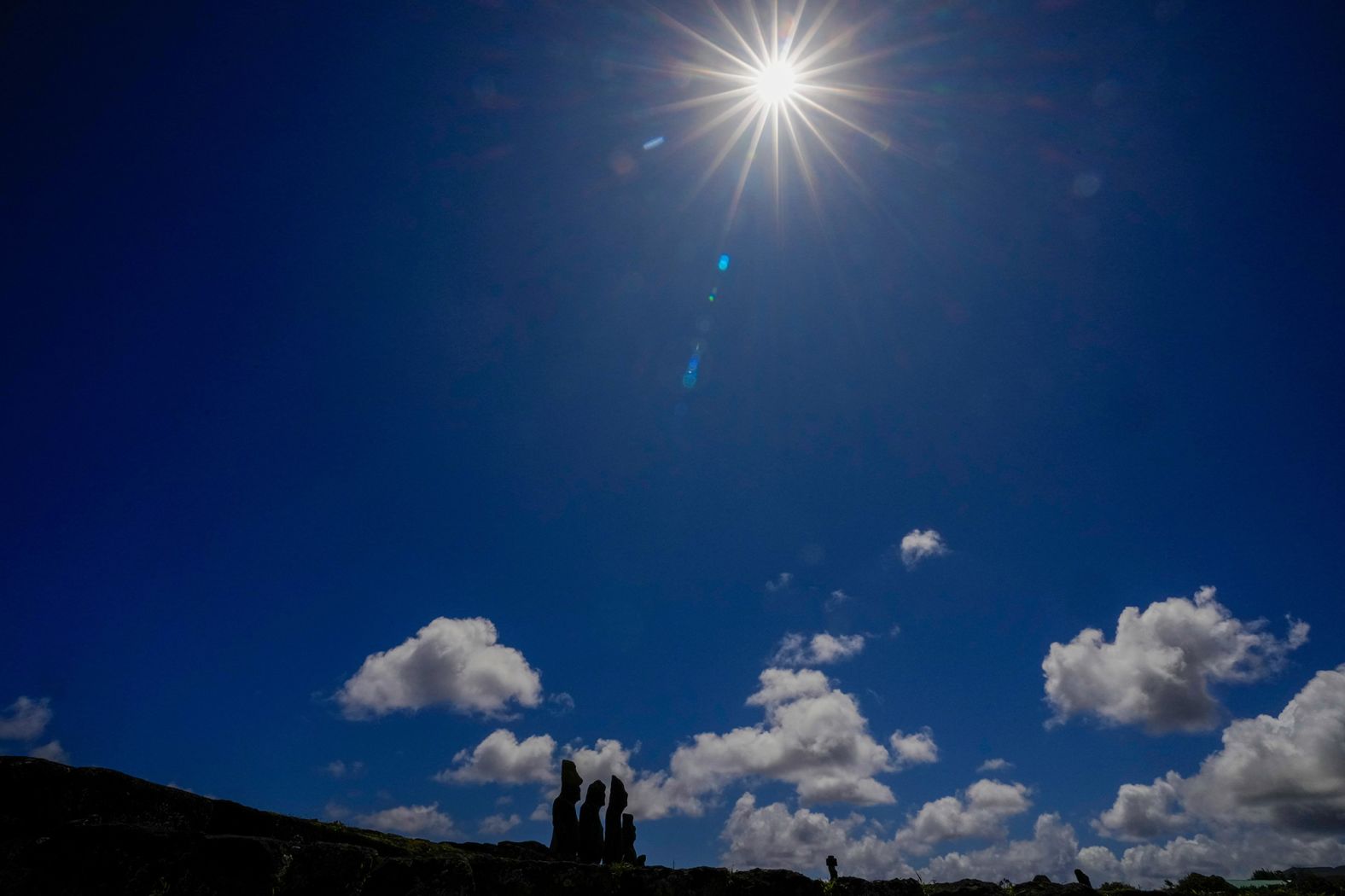 Easter Island's famous Moai statues are seen below the sun during the eclipse.