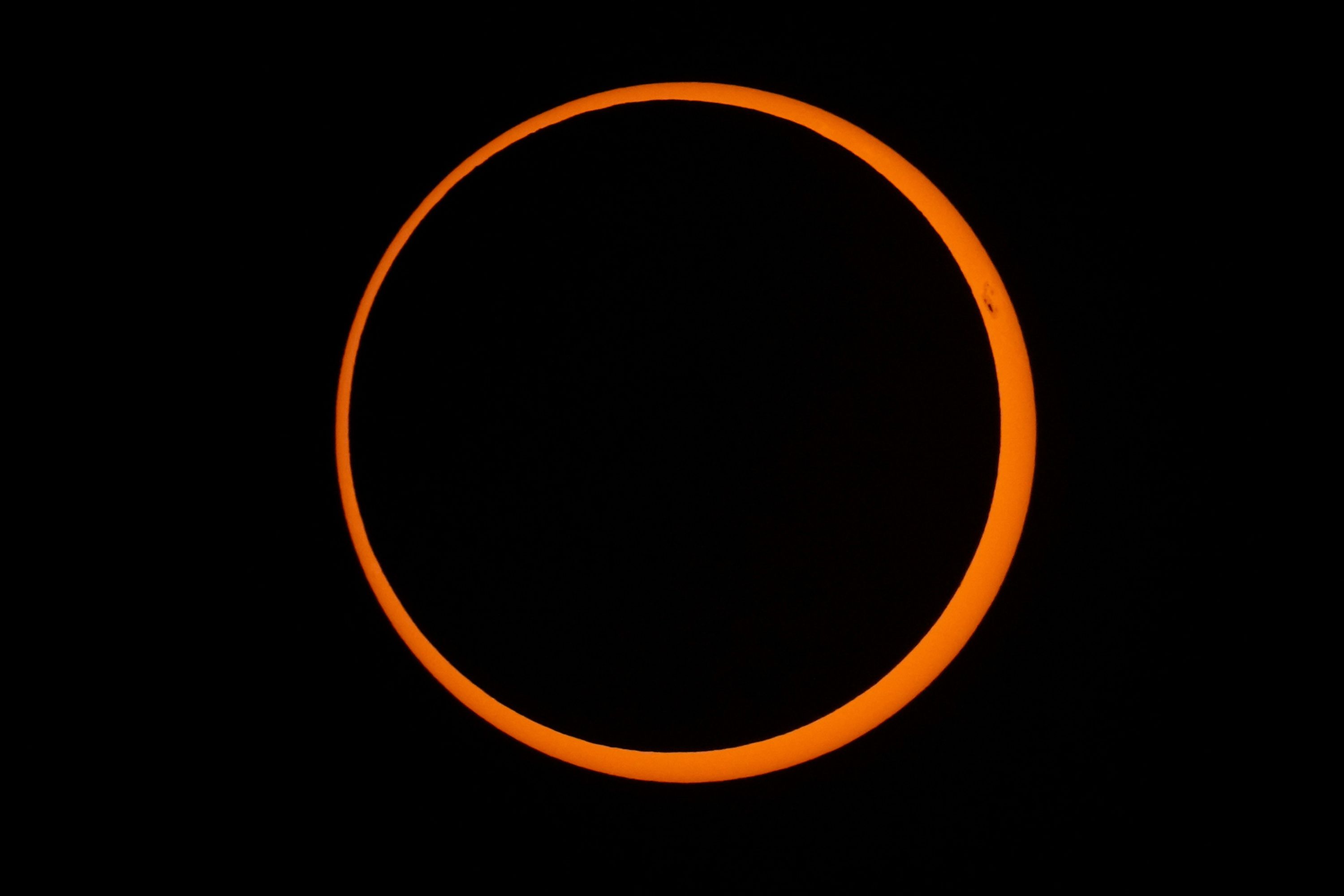 The moon moves across the sun during an annular solar eclipse seen from the southeastern Pacific territory of Rapa Nui, also known as Easter Island, on Wednesday, October 2.