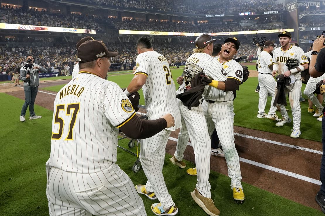 The San Diego Padres celebrate after defeating the Atlanta Braves.