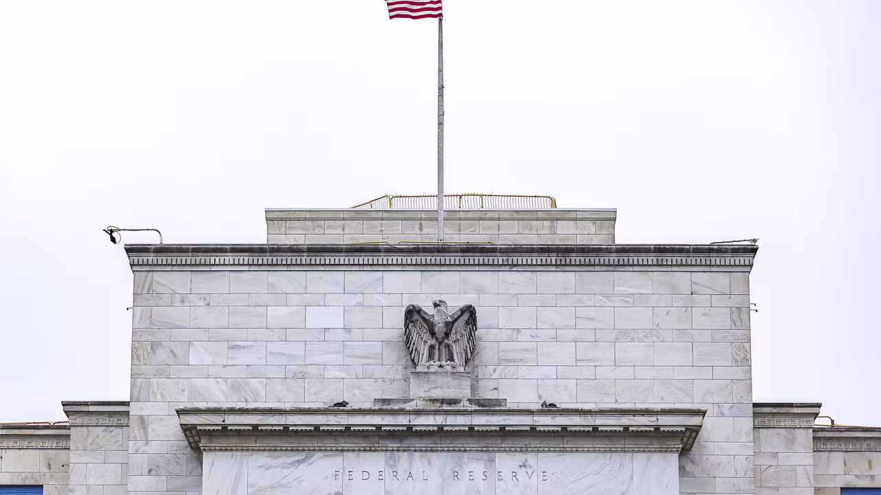 The US flag flies at the Federal Reserve on October 3 in Washington, DC.