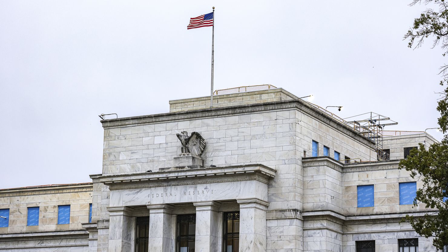 The US flag flies over the Federal Reserve on October 3 in Washington, DC.