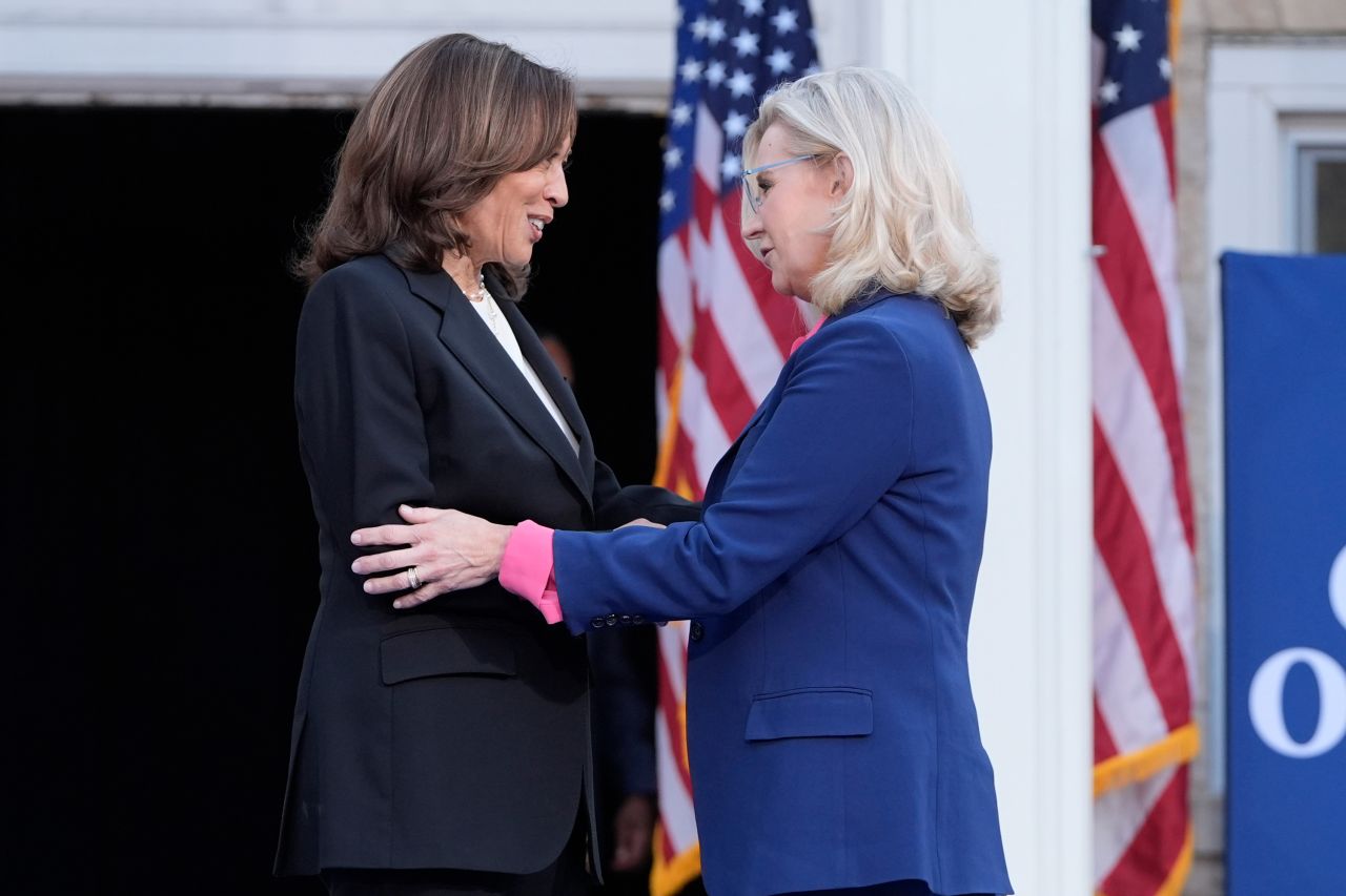 Kamala Harris, left, is greeted by Liz Cheney, during a campaign event at Ripon College in Ripon, Wisconsin, on October 3.