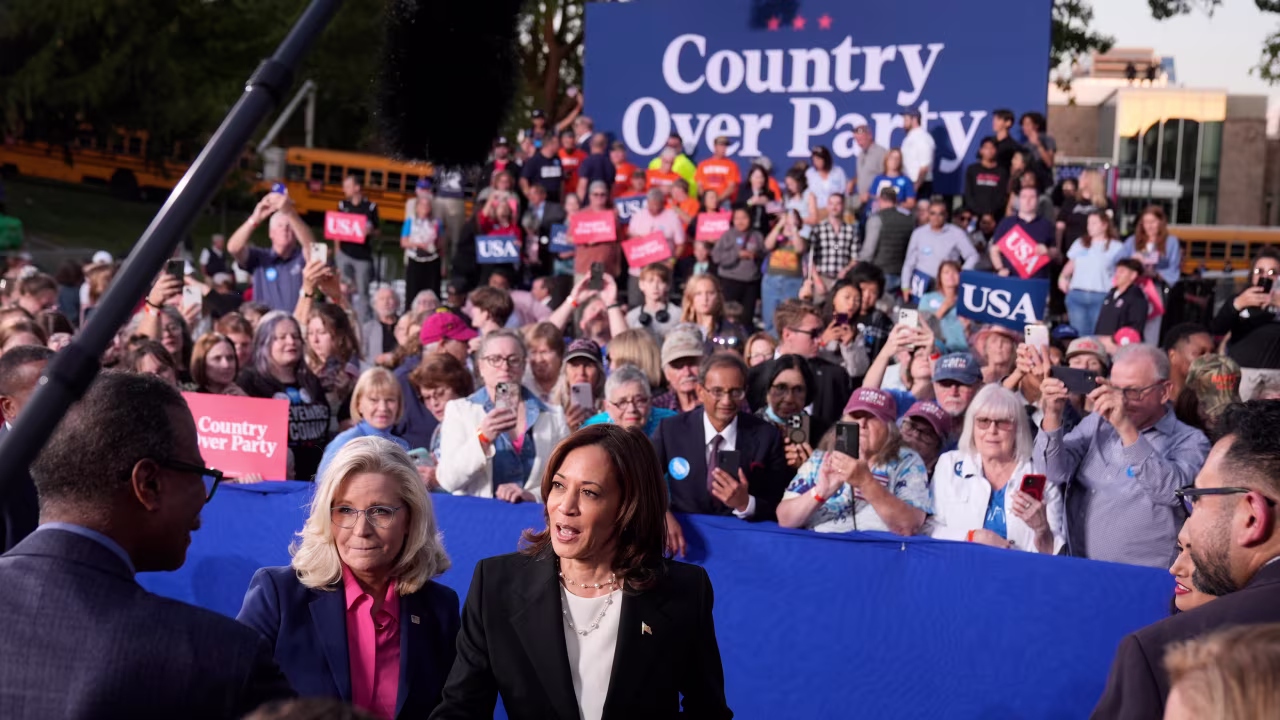 Kamala Harris, right, and Liz Cheney, greet attendees during a campaign event at Ripon College in Ripon, Wisconsin, on October 3.