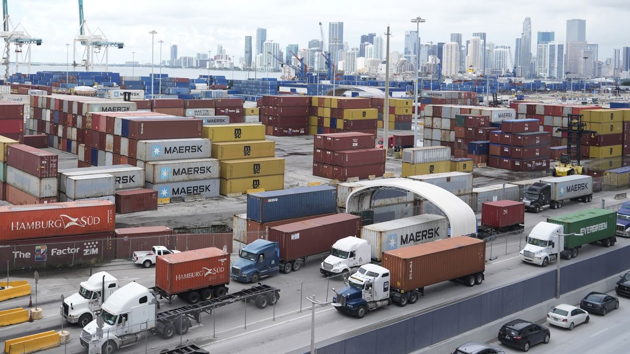 Trucks line up to enter Port Miami, after the union representing 45,000 striking U.S. dockworkers reached a deal to suspend a three-day strike, Friday, Oct. 4, 2024, in Miami.