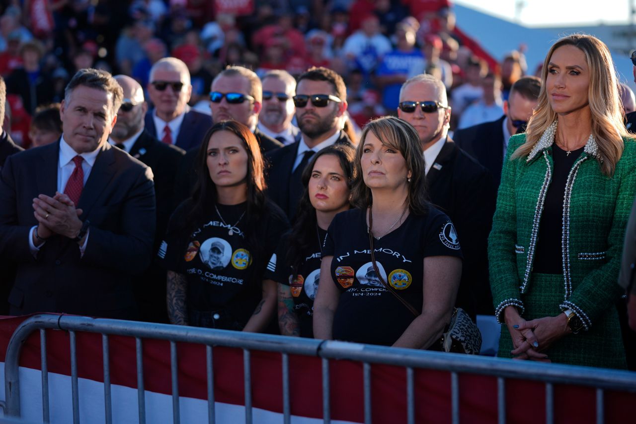 Family members of Corey Comperatore, including his wife Helen, second from right, stand with Lara Trump and Senate candidate Dave McCormick, left, during the campaign rally on Saturday.