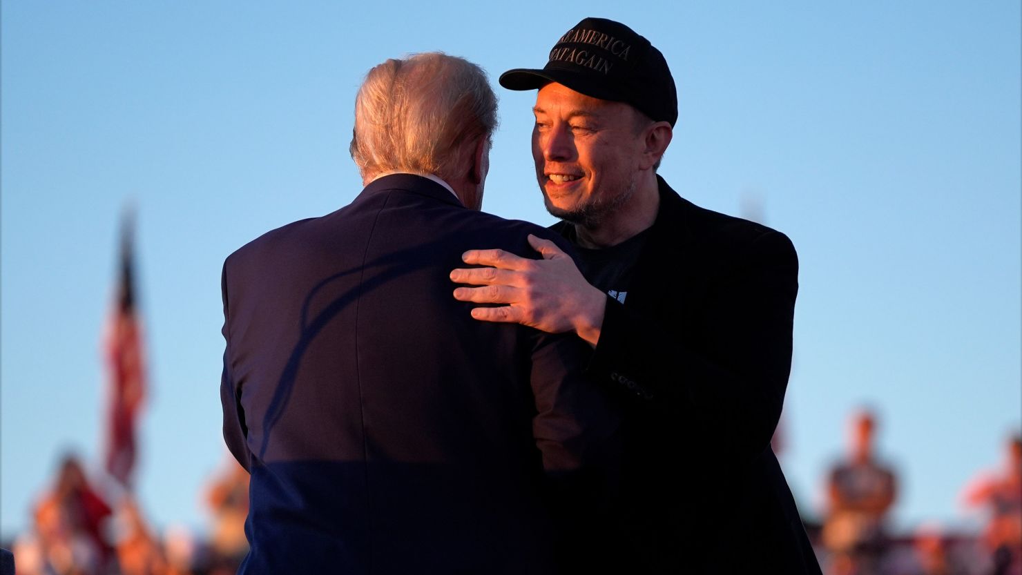 Former President Donald Trump hugs Elon Musk at a campaign rally at the Butler Farm Show on October 5, 2024, in Butler, Pennsylvania.