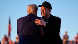 Republican presidential nominee former President Donald Trump hugs Elon Musk at a campaign rally at the Butler Farm Show, Saturday, Oct. 5, 2024, in Butler, Pa. (AP Photo/Evan Vucci)