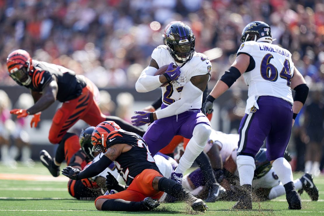 Henry's 51-yard run in overtime set up the game-winning kick against the Bengals.