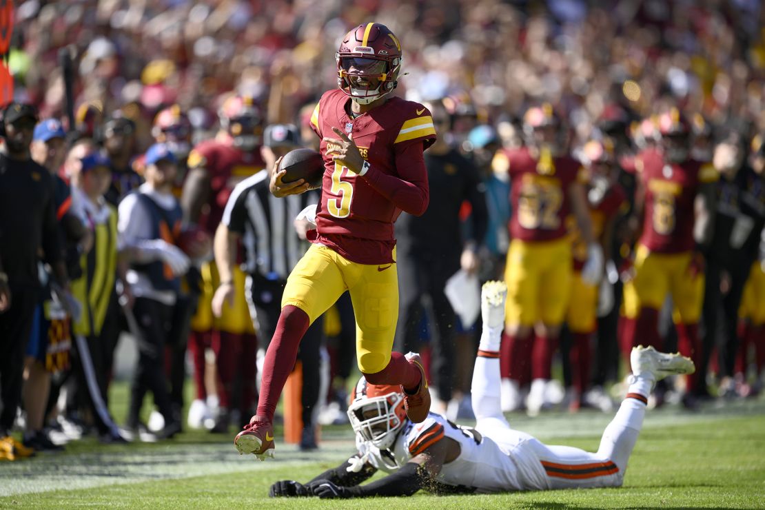 Daniels runs past the Cleveland Browns defense on Sunday.