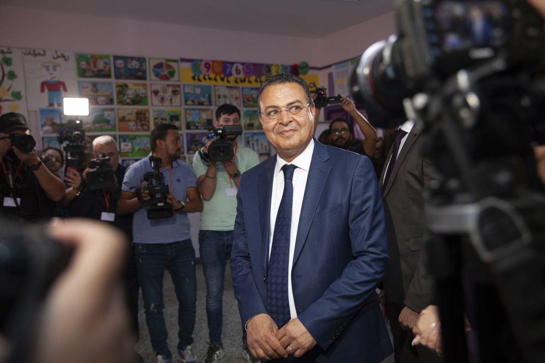 Tunisian presidential candidate Zouhair Maghzaoui prepares to cast his vote at a polling station in the capital Tunis on Oct. 6, 2024.